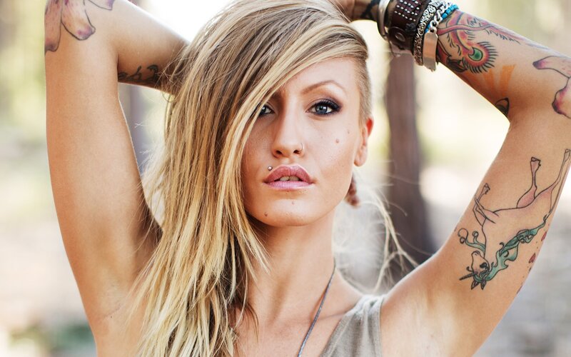 tattooed woman with blonde hair