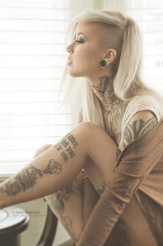 tattooed woman with blonde hair