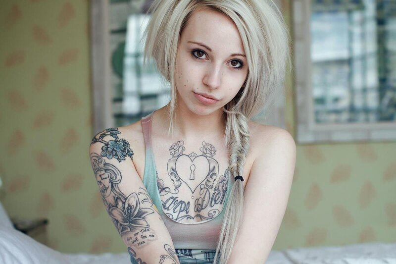 tattooed woman with blonde hair