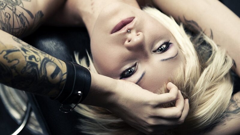tattooed woman with blonde hair