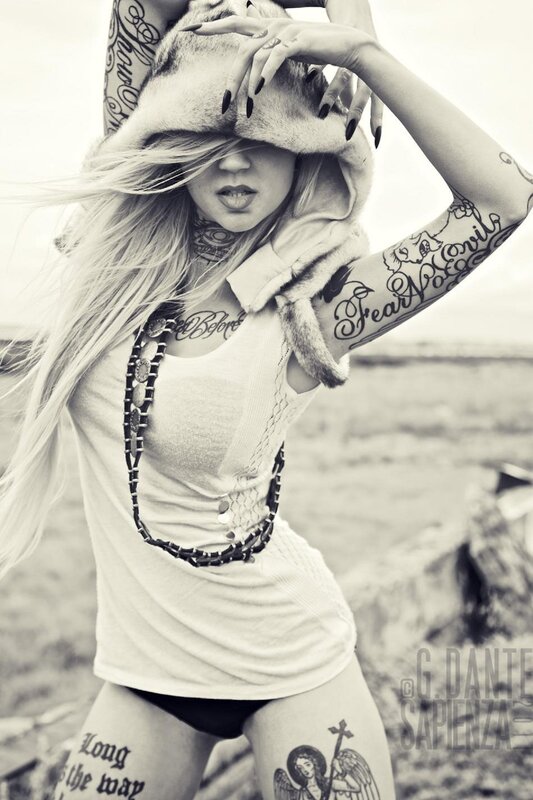 tattooed woman with fur hat