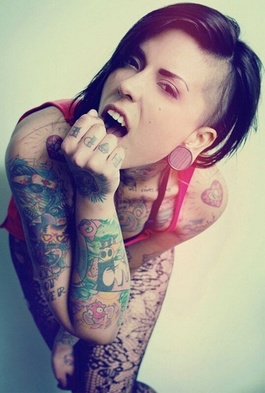 tattooed woman with piercings