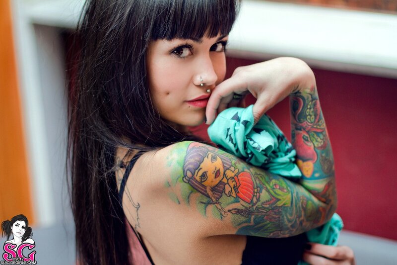 tattooed woman with piercings