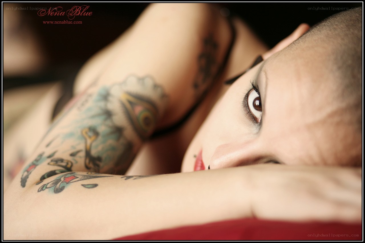 tattooed woman with shaved head