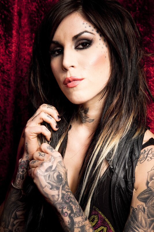 tattooed woman with star makeup