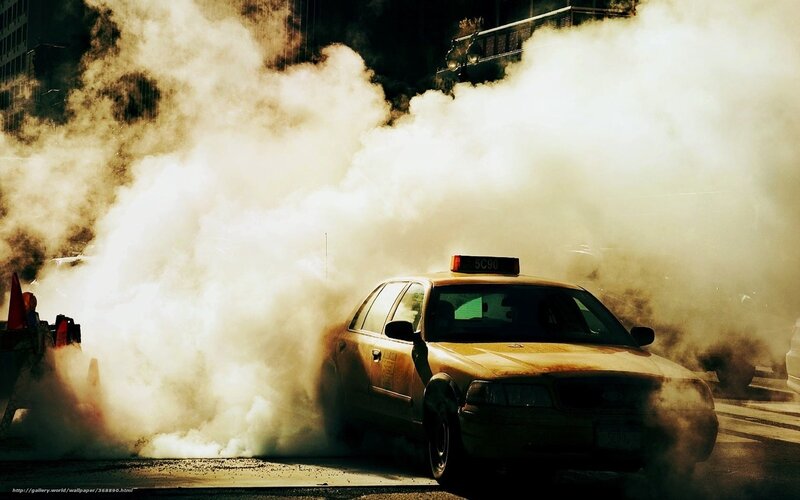Taxi surrounded by smoke