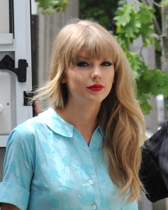 Taylor Swift in a blue shirt