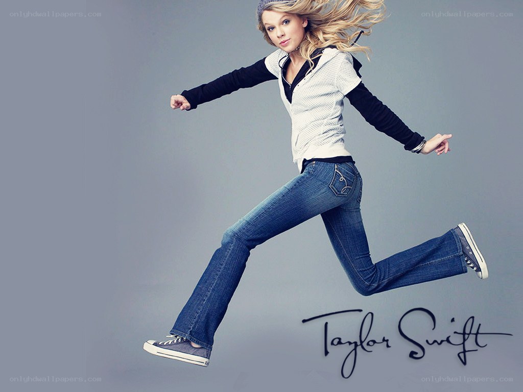 Taylor Swift jumping in jeans