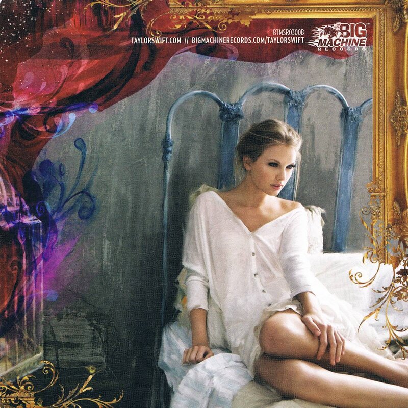Taylor Swift on a bed