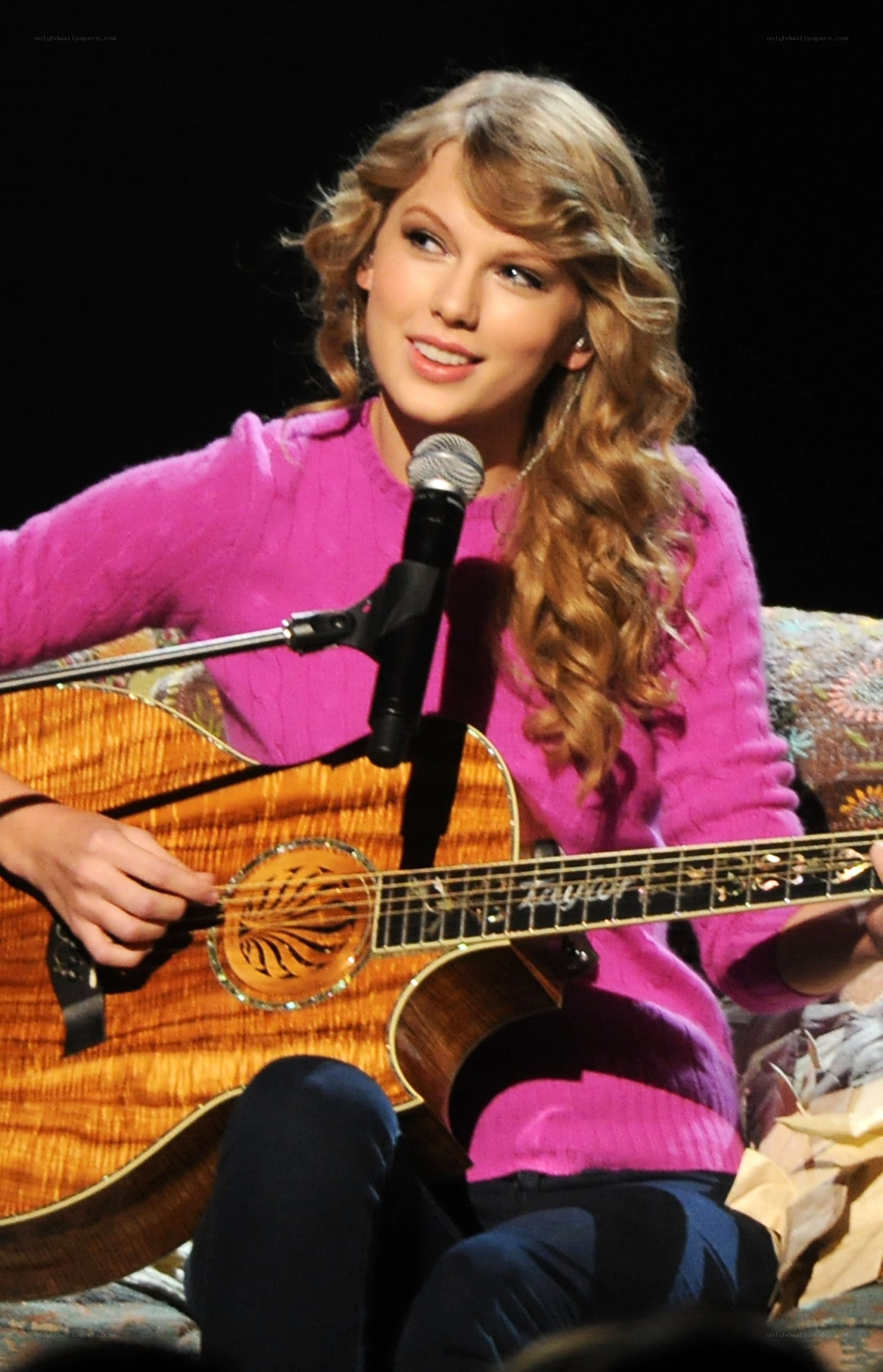 Taylor Swift playing guitar