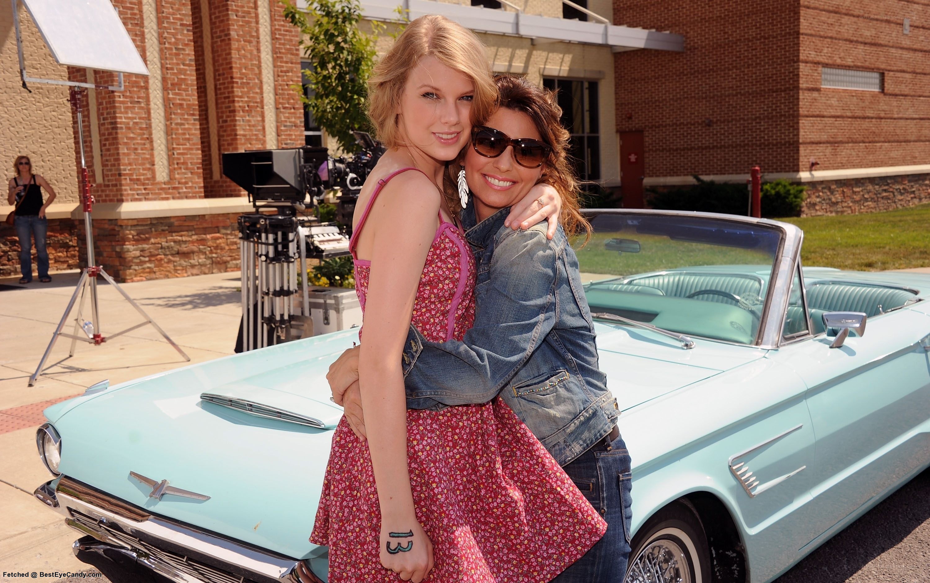 Taylor Swift with a friend on set