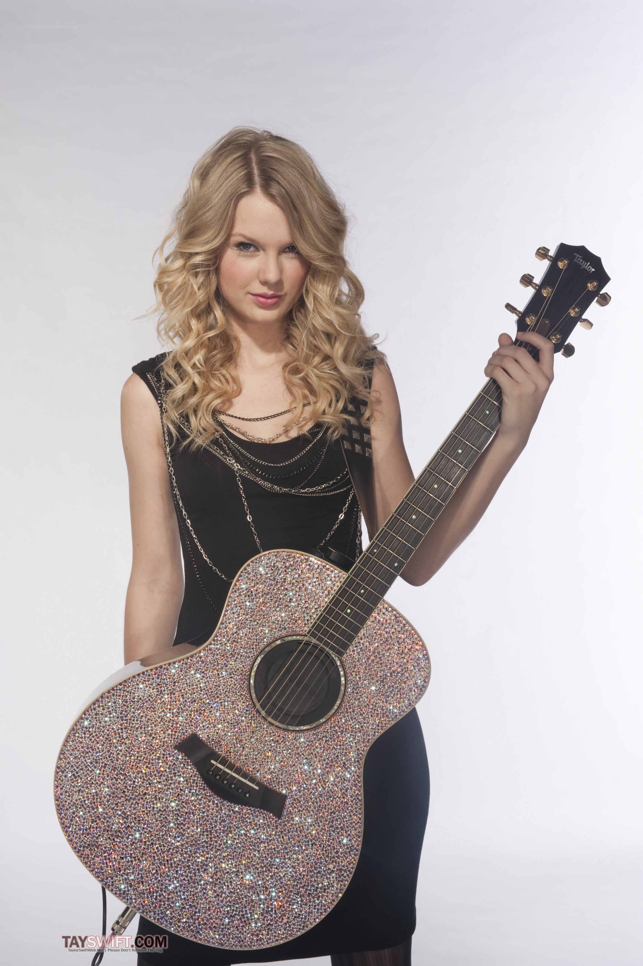 Taylor Swift with a sparkly guitar