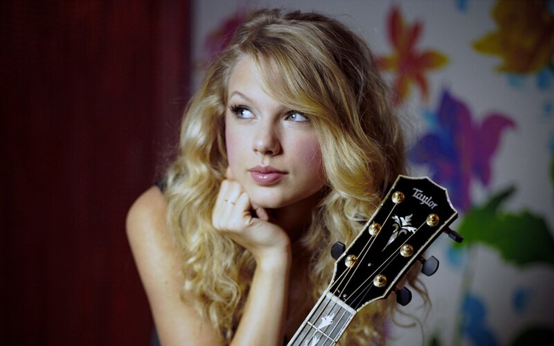 Taylor Swift with acoustic guitar