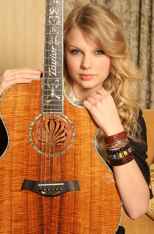 Taylor Swift with acoustic guitar