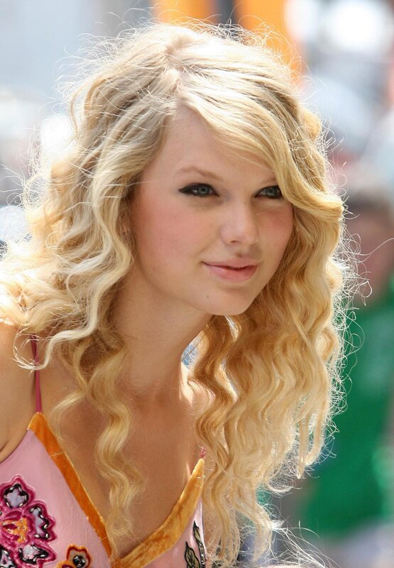 Taylor Swift with curly blonde hair