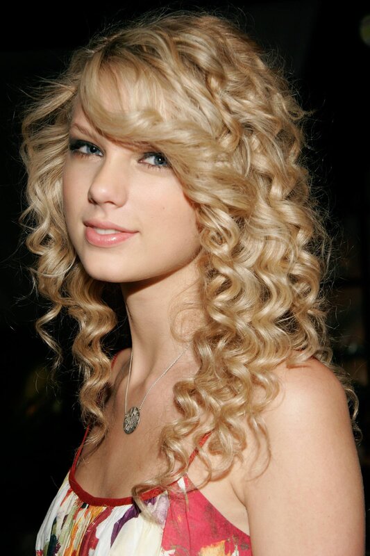 Taylor Swift with curly blonde hair
