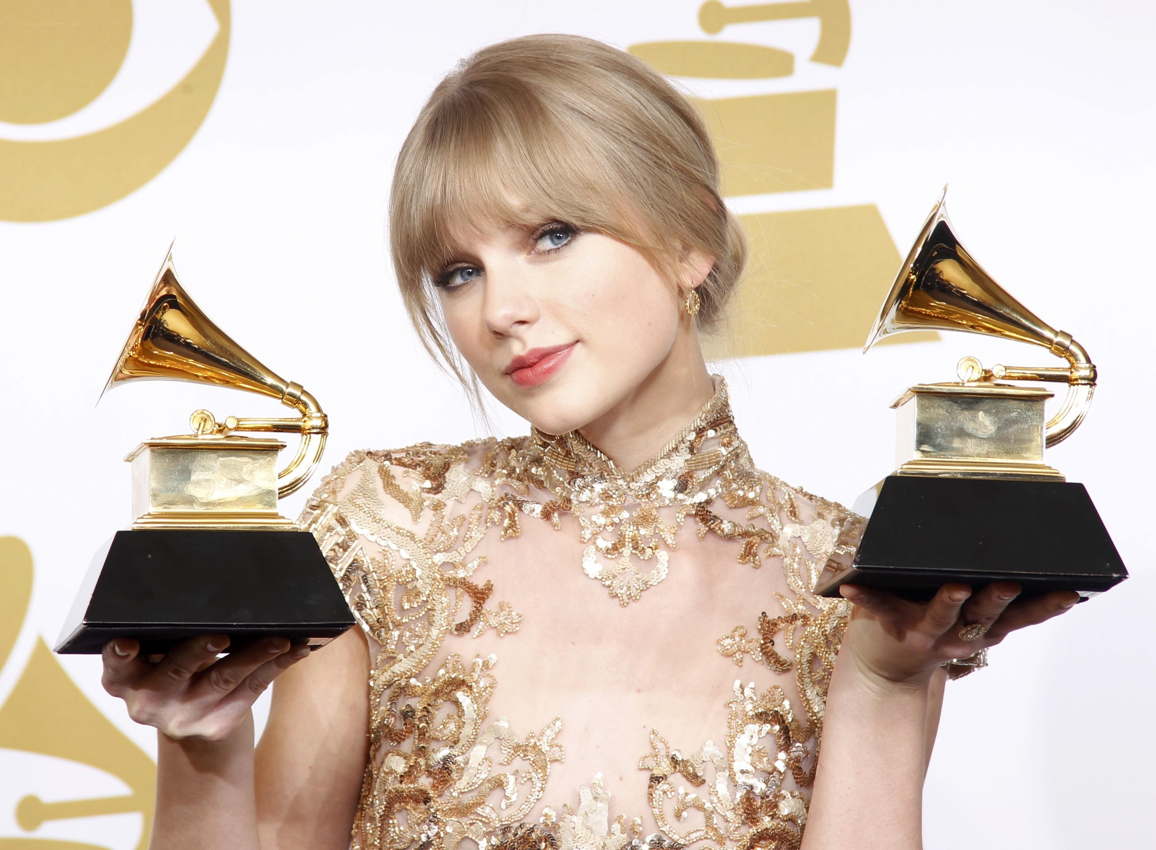 Taylor Swift with Grammy awards