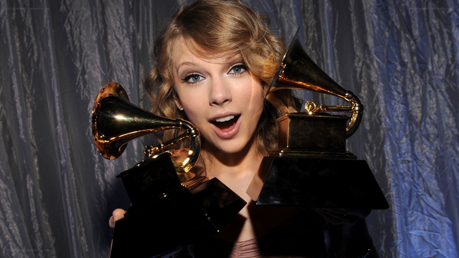 Taylor Swift with Grammy Awards