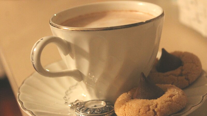 tea and cookies with pocket watch
