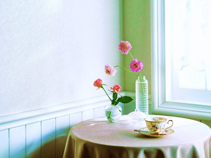 Tea and flowers by the window