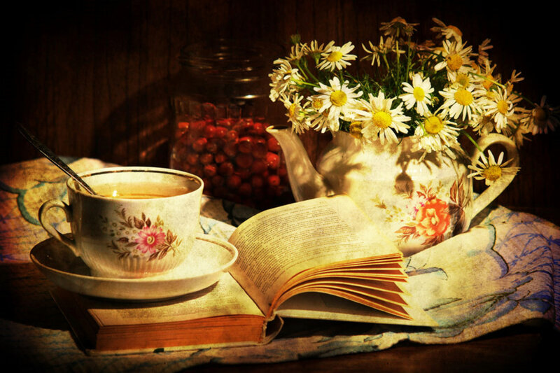 Tea and flowers on a book