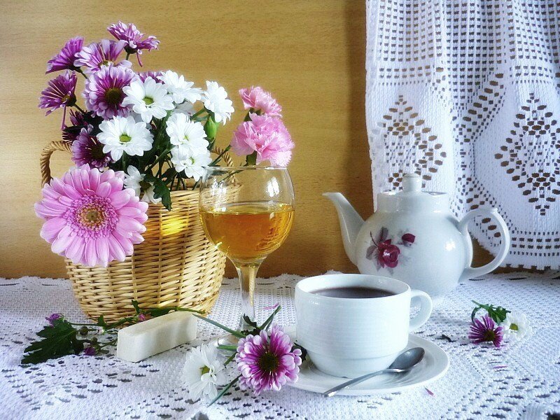Tea and flowers on a lace table