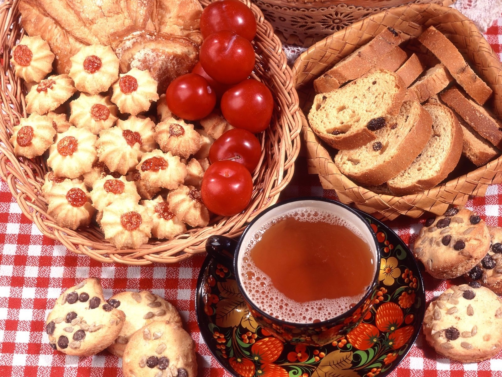 Tea and pastries on checkered cloth