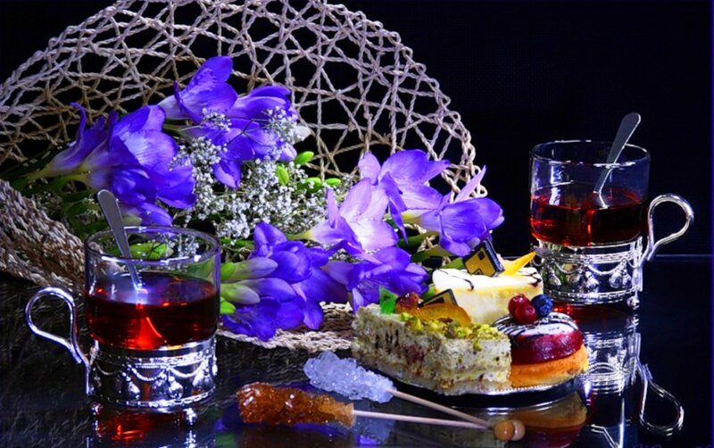 Tea and Pastries on Table — Purple
