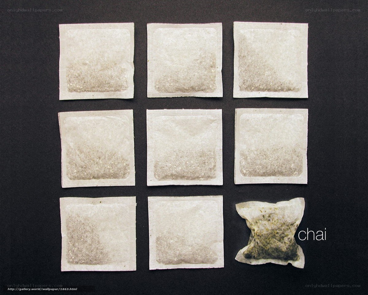 Tea bags on black background