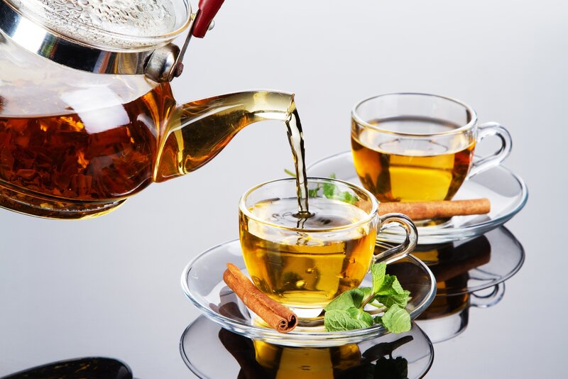 Tea Being Poured — Brown