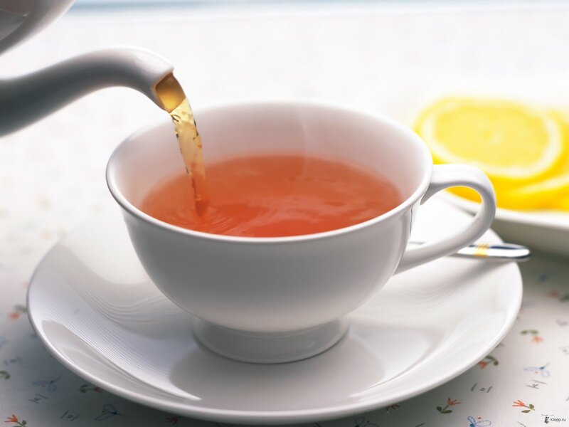 tea being poured into a cup