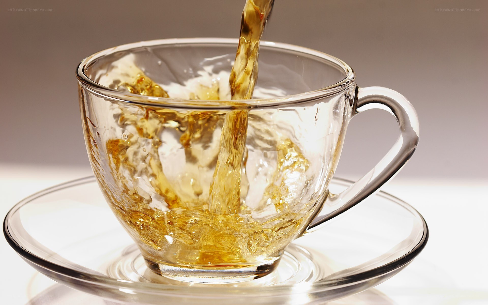 tea being poured into a cup