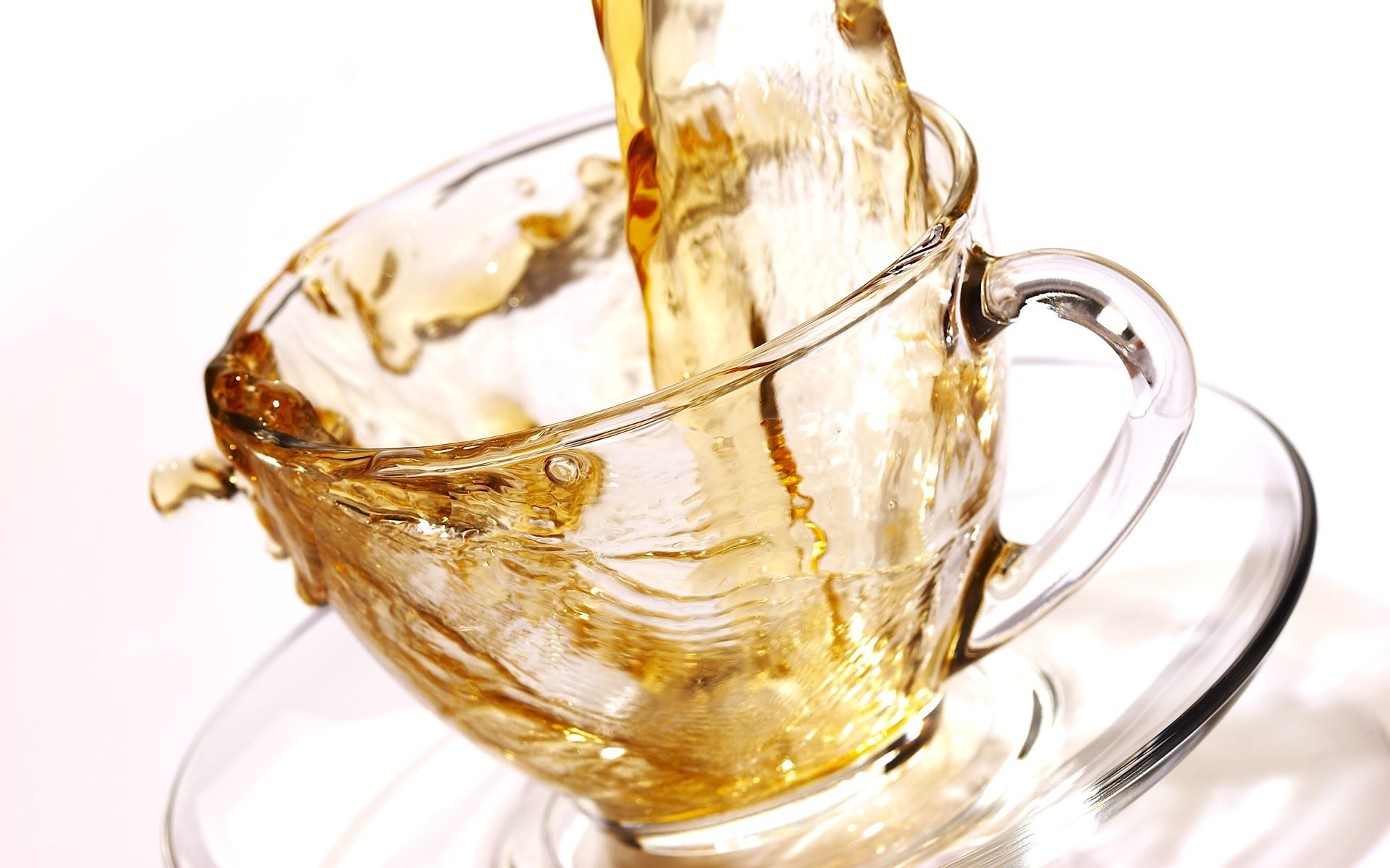 tea being poured into a cup