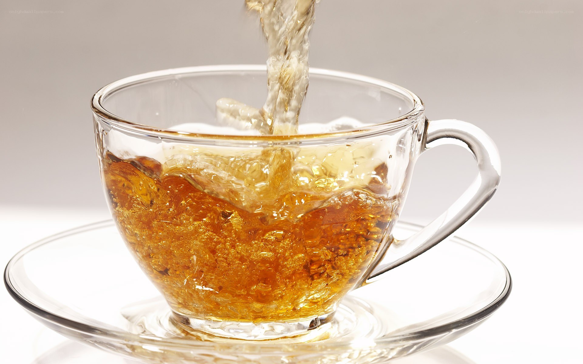 tea being poured into a cup