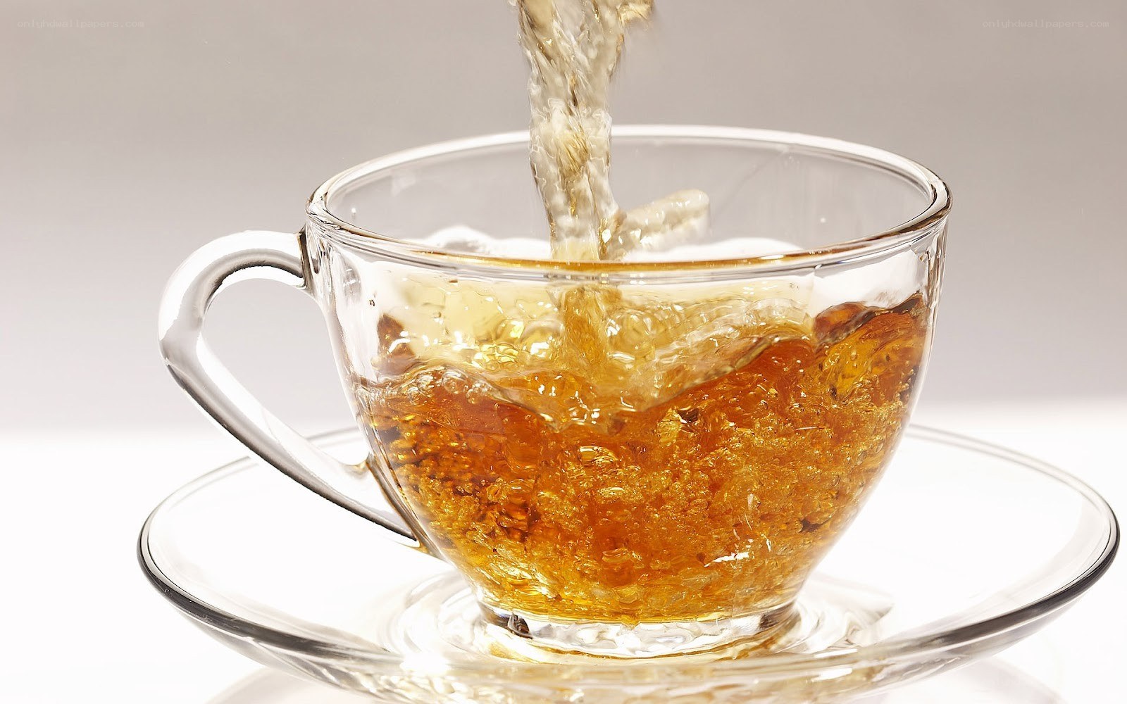 tea being poured into a cup
