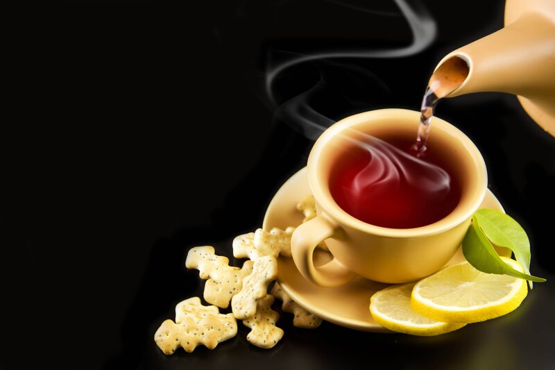 Tea Being Poured into Cup — Black