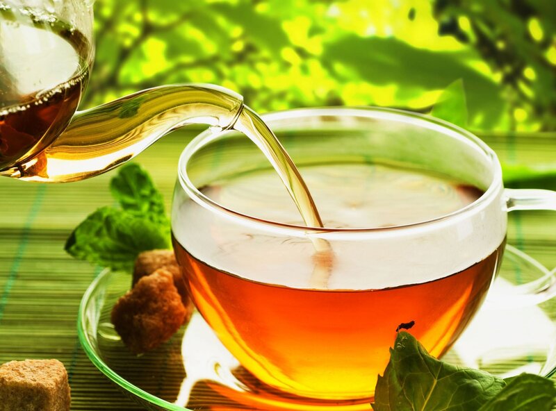 Tea Being Poured into Cup — Green, Serene