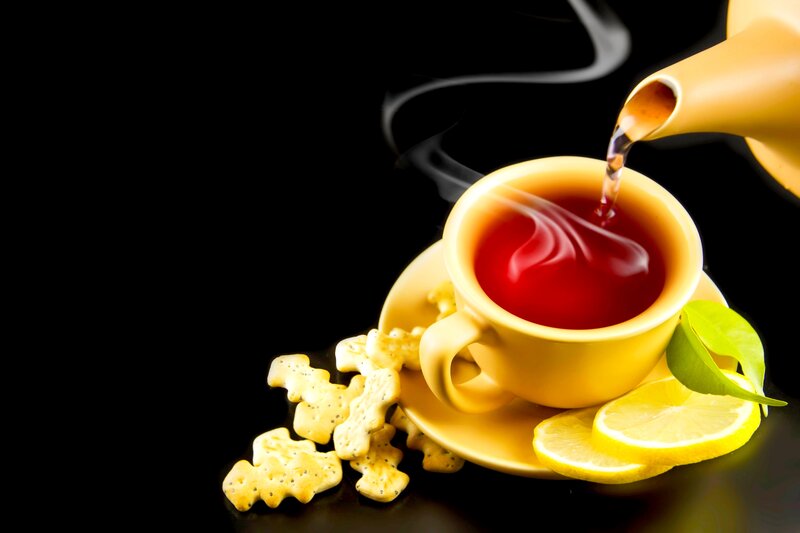 Tea Being Poured into Cup — Yellow