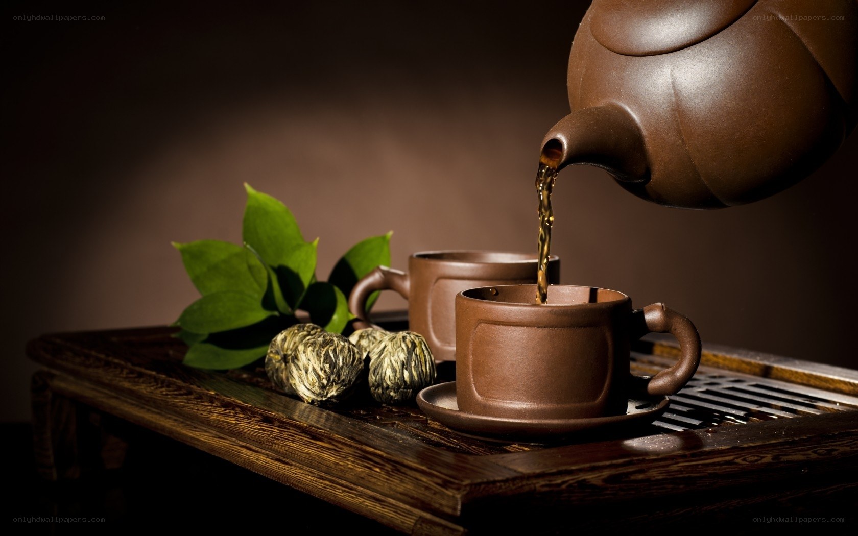 tea being poured into cup