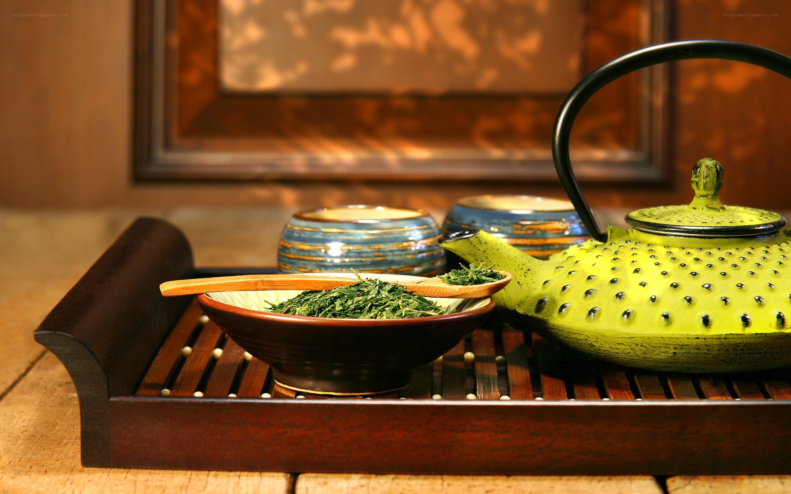Tea ceremony setup with green teapot