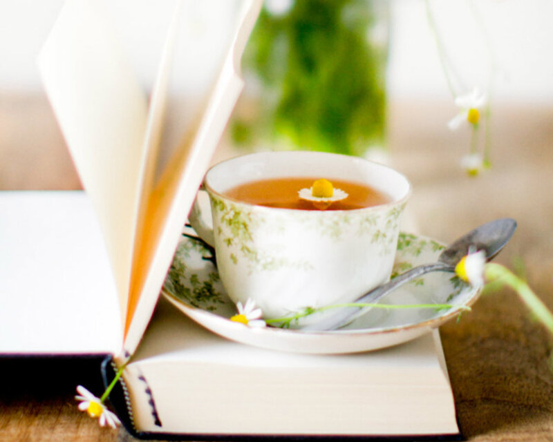 Tea Cup on Open Book — White