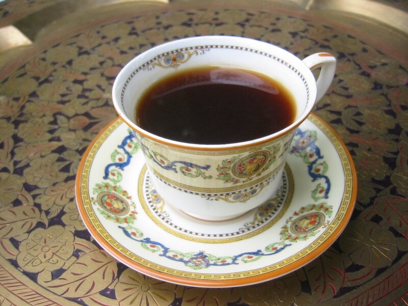 tea cup on ornate tray
