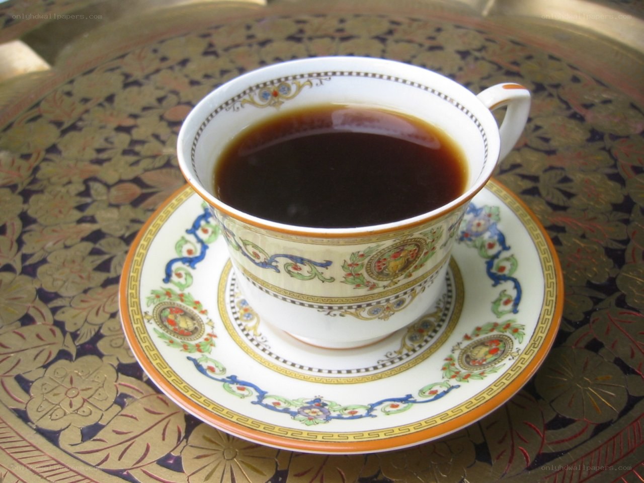 tea cup on ornate tray