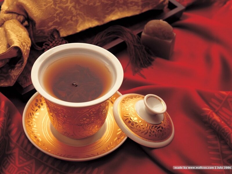 tea cup on red cloth