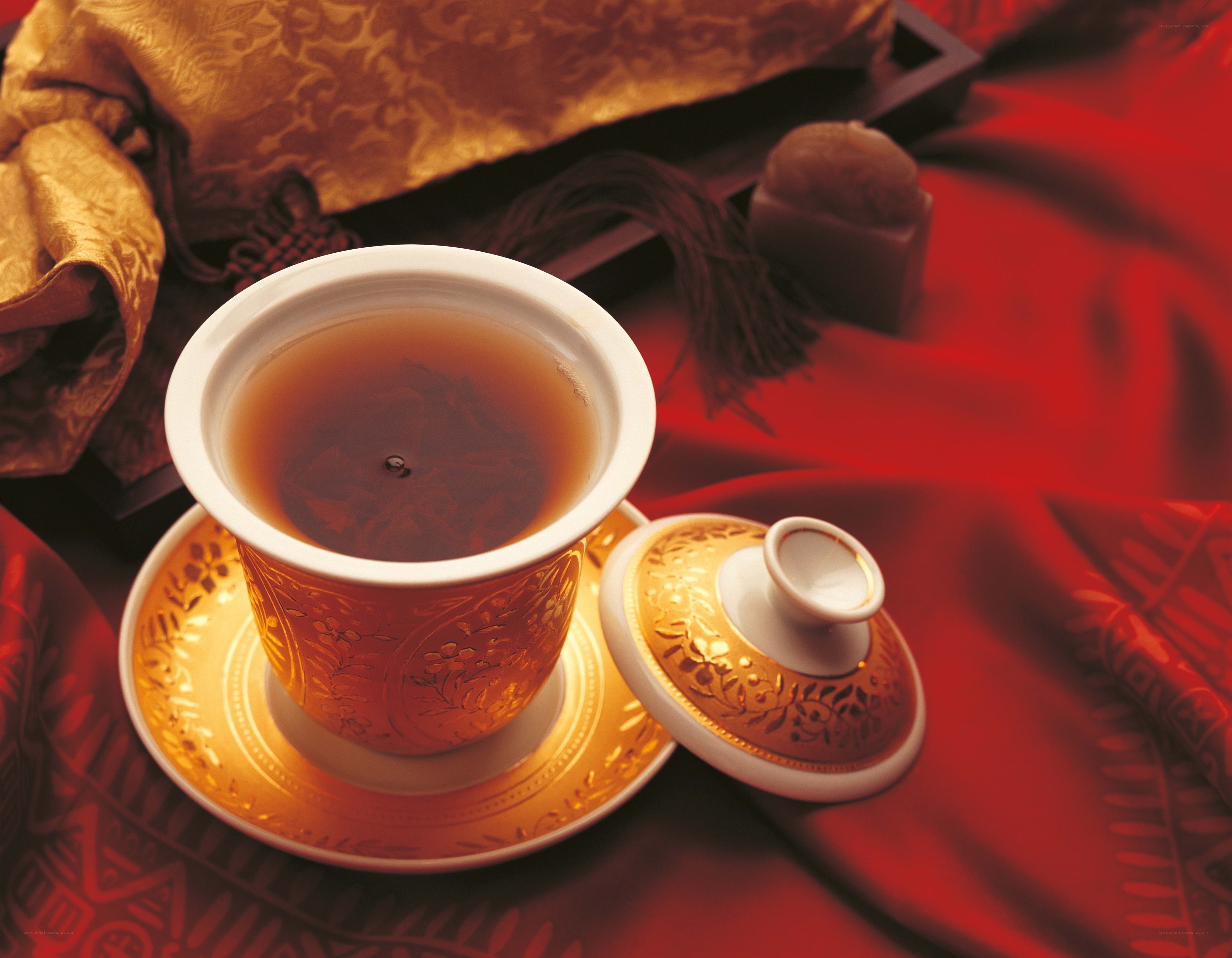 tea cup on red fabric