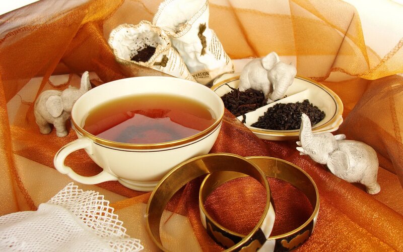 Tea Cup with Tea Leaves — Orange, Calm