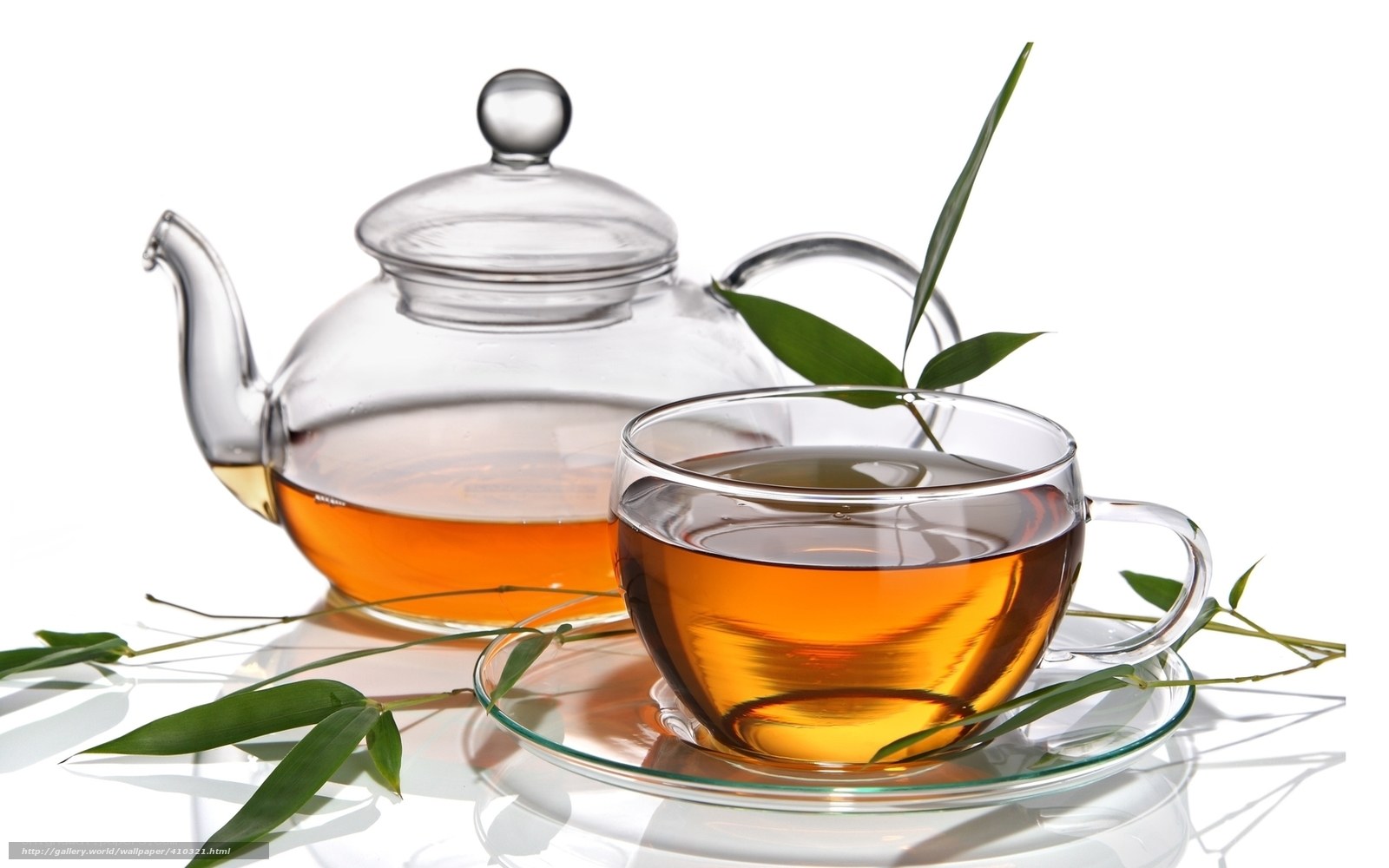 Tea in glass cup and teapot