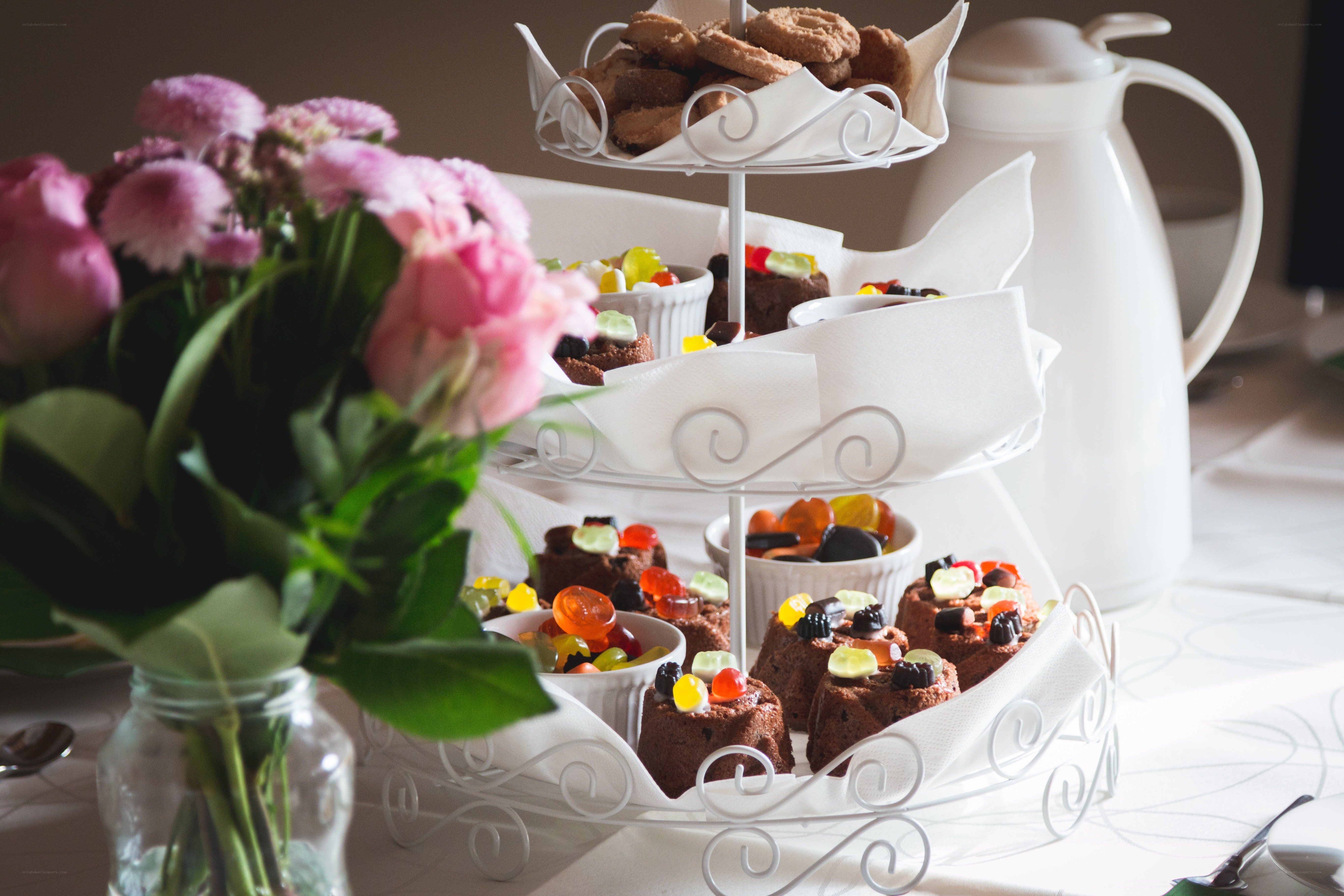 Tea party with sweets and flowers