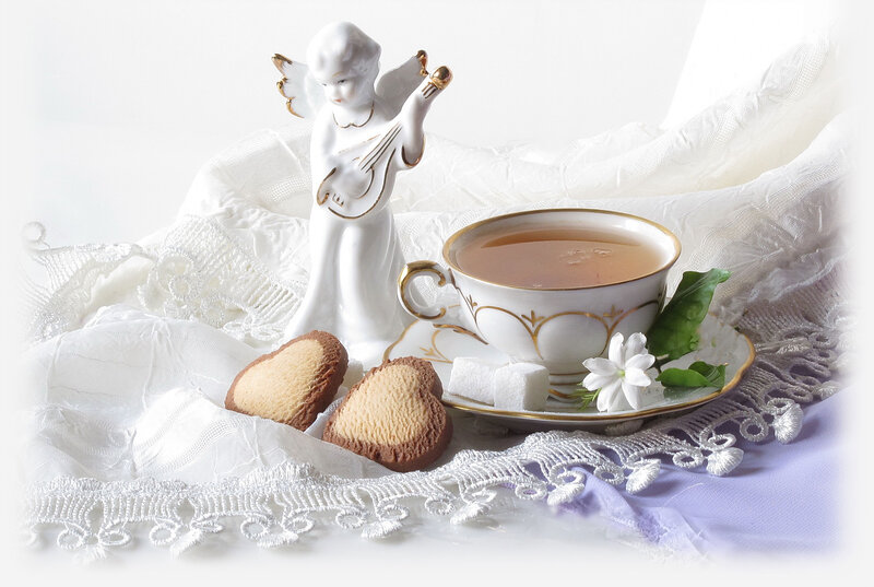 Tea Set with Angel Figurine — White, Serene, Photograph