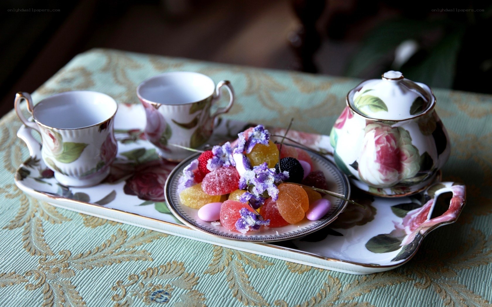 Tea set with candies on tray